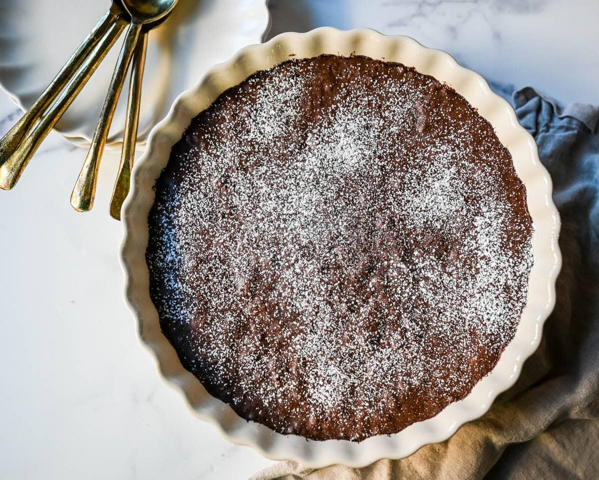 Brownie pudding is the viral, ultra-rich chocolate dessert combining the best parts of brownies and molten lava cake. This easy dessert bakes into a crackly top with a gooey, fudgy, pudding-like center that is chocolate lover's dream dessert. Made famous by Ina Garten, brownie pudding is trending everywhere on TikTok, thanks to its simple ingredients, decadent texture, and rich flavor. You will love Ina Garten's Brownie Pudding recipe!