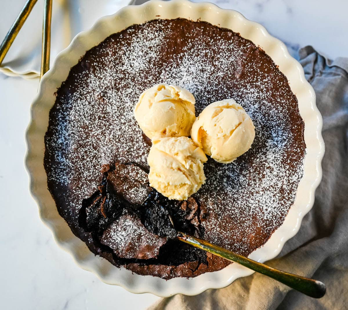 Brownie pudding is the viral, ultra-rich chocolate dessert combining the best parts of brownies and molten lava cake. This easy dessert bakes into a crackly top with a gooey, fudgy, pudding-like center that is chocolate lover's dream dessert. Made famous by Ina Garten, brownie pudding is trending everywhere on TikTok, thanks to its simple ingredients, decadent texture, and rich flavor. You will love Ina Garten's Brownie Pudding recipe!