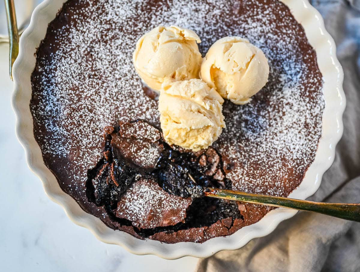 Brownie pudding is the viral, ultra-rich chocolate dessert combining the best parts of brownies and molten lava cake. This easy dessert bakes into a crackly top with a gooey, fudgy, pudding-like center that is chocolate lover's dream dessert. Made famous by Ina Garten, brownie pudding is trending everywhere on TikTok, thanks to its simple ingredients, decadent texture, and rich flavor. You will love Ina Garten's Brownie Pudding recipe!