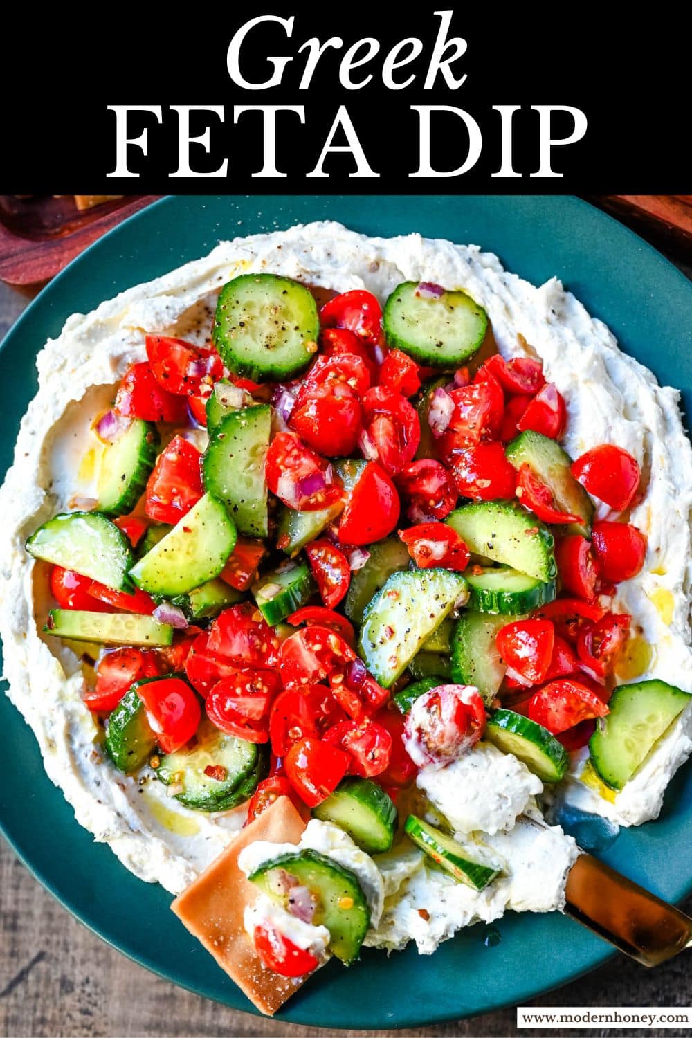 This Greek feta dip is the ultimate party and holiday appetizer that is rich, creamy, and so flavorful! It blends tangy feta, cream cheese, lemon, oregano, and olive oil into a silky whipped dip that feels fancy but takes just minutes to make. Pile it high with tomatoes, cucumbers, and a drizzle of olive oil, then serve with pita chips or veggies.