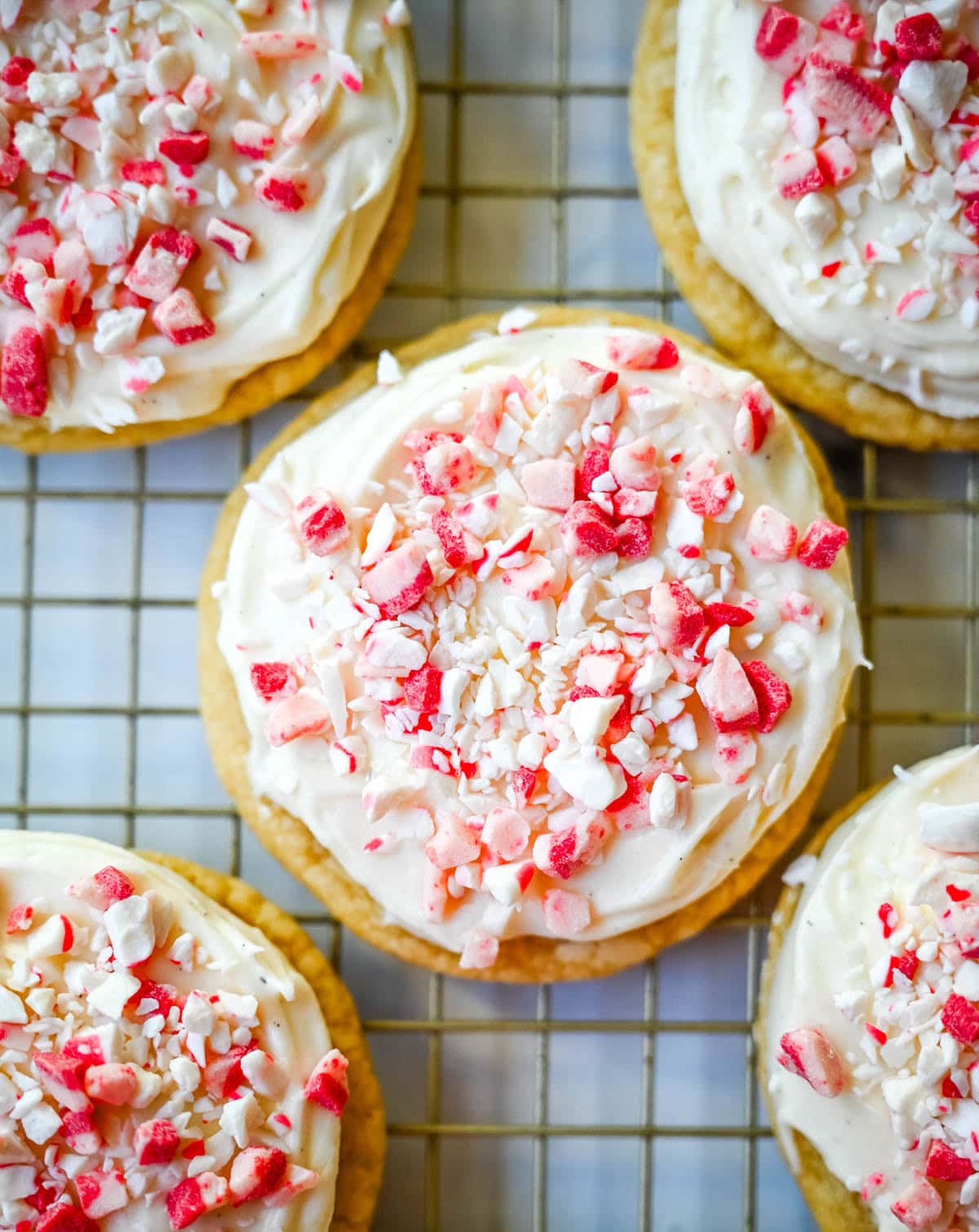 These Peppermint Frosted Sugar Cookies are soft, chewy, and topped with the creamiest peppermint cream cheese frosting. If you love peppermint desserts or are looking for a crowd-favorite holiday cookie, this peppermint cookie recipe is always a hit.