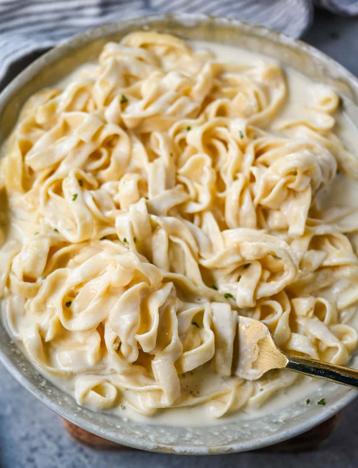 This is the best Alfredo sauce recipe that's rich, creamy, and made completely from scratch with butter, heavy cream, garlic, and freshly grated parmesan. This classic homemade Alfredo sauce comes together in under 20 minutes and is way better than anything in a jar.