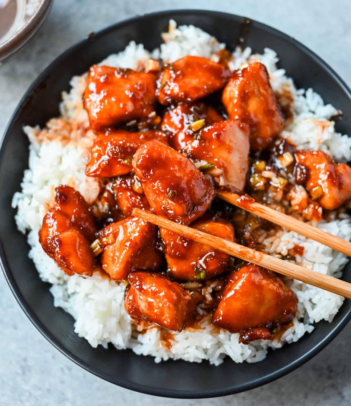 This sticky honey gochujang chicken is a quick and easy 30-minute dinner recipe with Korean-inspired flavor. Juicy chicken breast is coated in a sweet, spicy glaze made with honey, garlic, soy sauce, and gochujang paste for a perfect melt-in-your-mouth texture. Serve it over coconut rice or noodles for a simple easy dinner recipe!