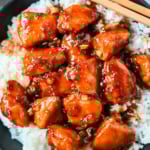 This sticky honey gochujang chicken is a quick and easy 30-minute dinner recipe with Korean-inspired flavor. Juicy chicken breast is coated in a sweet, spicy glaze made with honey, garlic, soy sauce, and gochujang paste for a perfect melt-in-your-mouth texture. Serve it over coconut rice or noodles for a simple easy dinner recipe!
