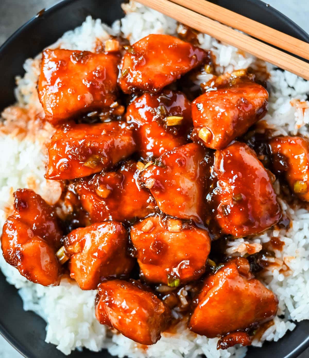 This sticky honey gochujang chicken is a quick and easy 30-minute dinner recipe with Korean-inspired flavor. Juicy chicken breast is coated in a sweet, spicy glaze made with honey, garlic, soy sauce, and gochujang paste for a perfect melt-in-your-mouth texture. Serve it over coconut rice or noodles for a simple easy dinner recipe!