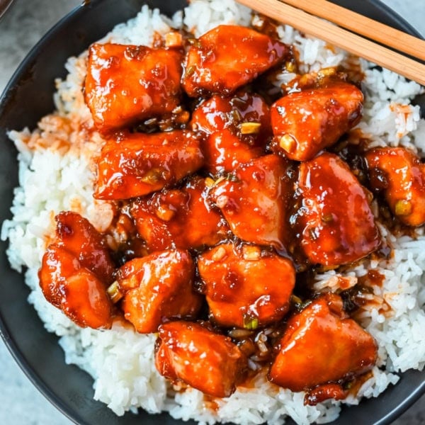 This sticky honey gochujang chicken is a quick and easy 30-minute dinner recipe with Korean-inspired flavor. Juicy chicken breast is coated in a sweet, spicy glaze made with honey, garlic, soy sauce, and gochujang paste for a perfect melt-in-your-mouth texture. Serve it over coconut rice or noodles for a simple easy dinner recipe!