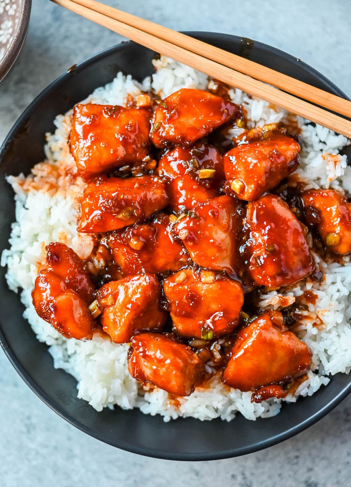 This sticky honey gochujang chicken is a quick and easy 30-minute dinner recipe with Korean-inspired flavor. Juicy chicken breast is coated in a sweet, spicy glaze made with honey, garlic, soy sauce, and gochujang paste for a perfect melt-in-your-mouth texture. Serve it over coconut rice or noodles for a simple easy dinner recipe!