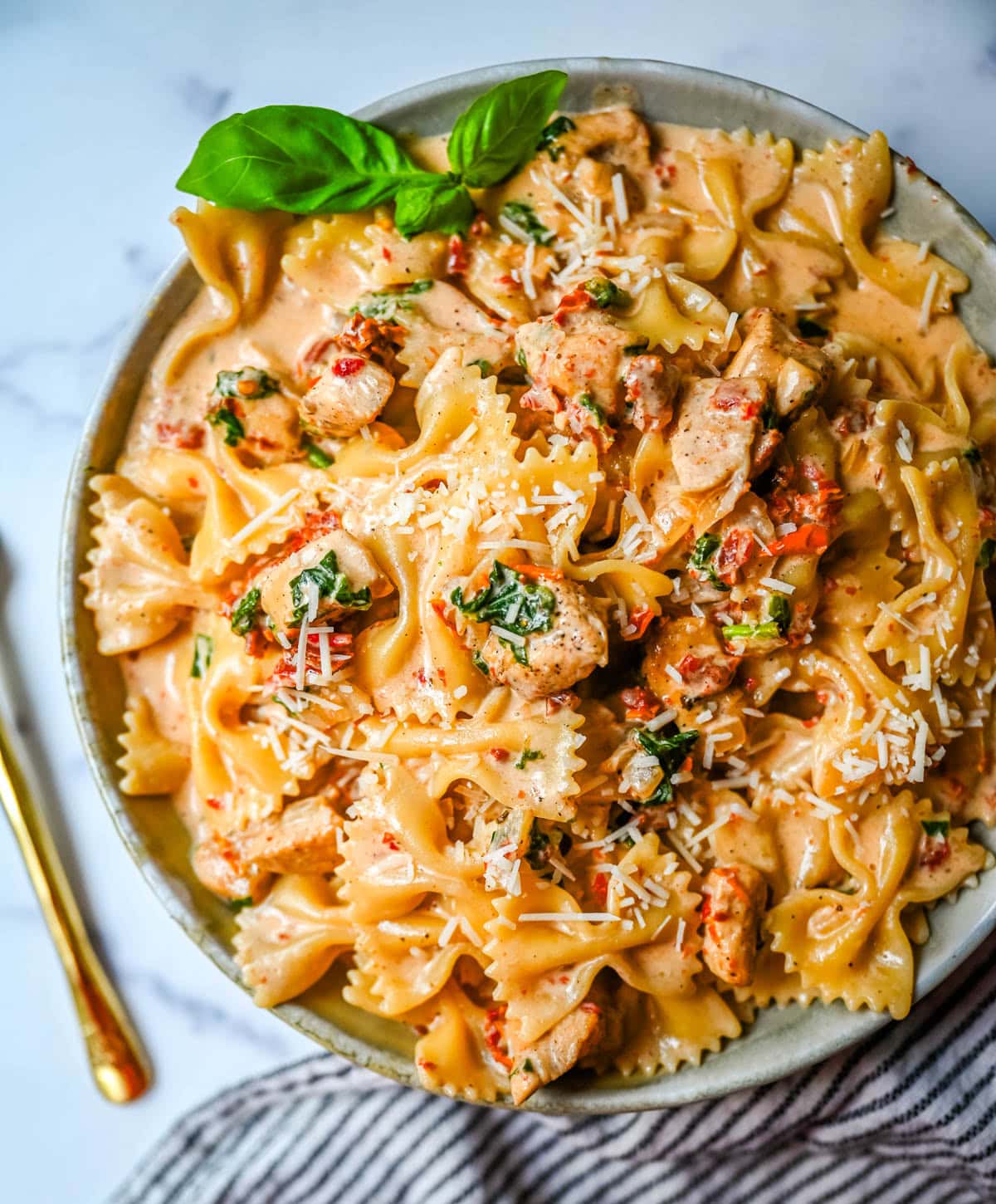 This Marry Me Chicken Pasta recipe features chicken, sun-dried tomatoes, heavy cream, parmesan cheese, and pasta in a rich, flavorful sauce. It’s a simple one-pan creamy chicken pasta that’s an easy dinner recipe!