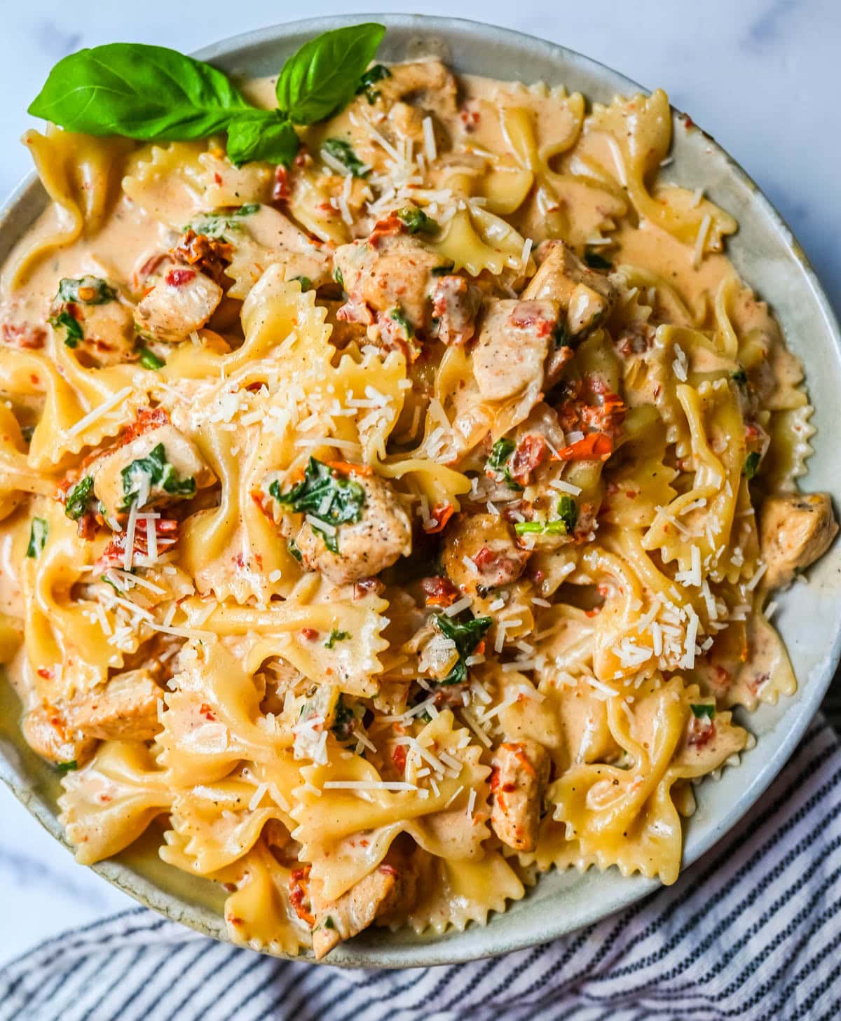 This Marry Me Chicken Pasta recipe features chicken, sun-dried tomatoes, heavy cream, parmesan cheese, and pasta in a rich, flavorful sauce. It’s a simple one-pan creamy chicken pasta that’s an easy dinner recipe!
