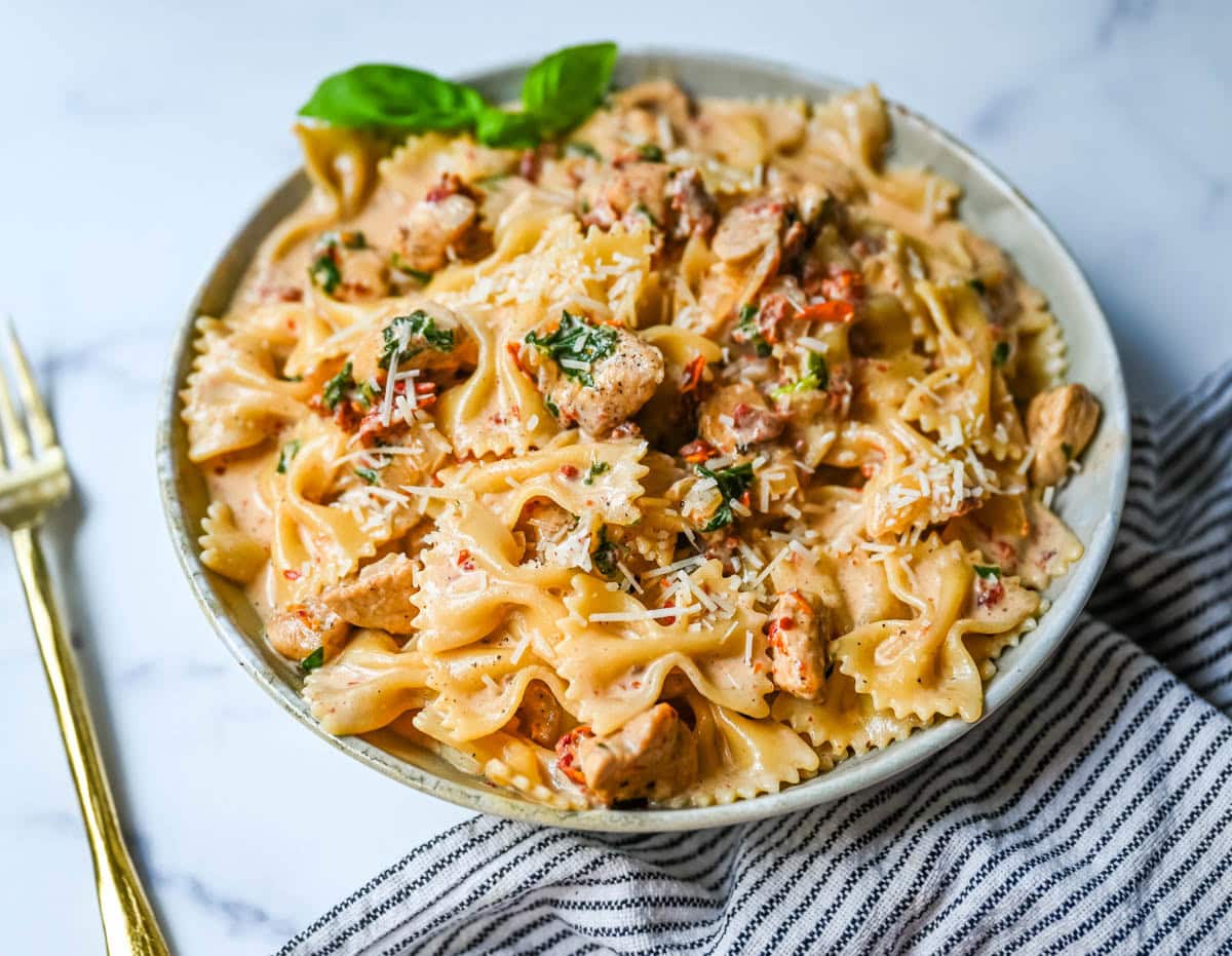 This Marry Me Chicken Pasta recipe features chicken, sun-dried tomatoes, heavy cream, parmesan cheese, and pasta in a rich, flavorful sauce. It’s a simple one-pan creamy chicken pasta that’s an easy dinner recipe!