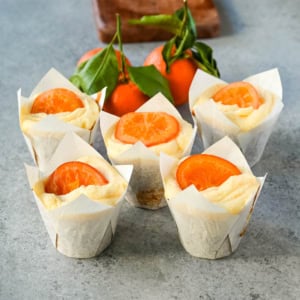 These moist orange olive oil cupcakes made with olive oil are light, tender, and bursting with fresh orange flavor. Sour cream adds richness while olive oil ensures a soft crumb. Finished with orange cream cheese frosting, these are the best orange cupcake recipe.