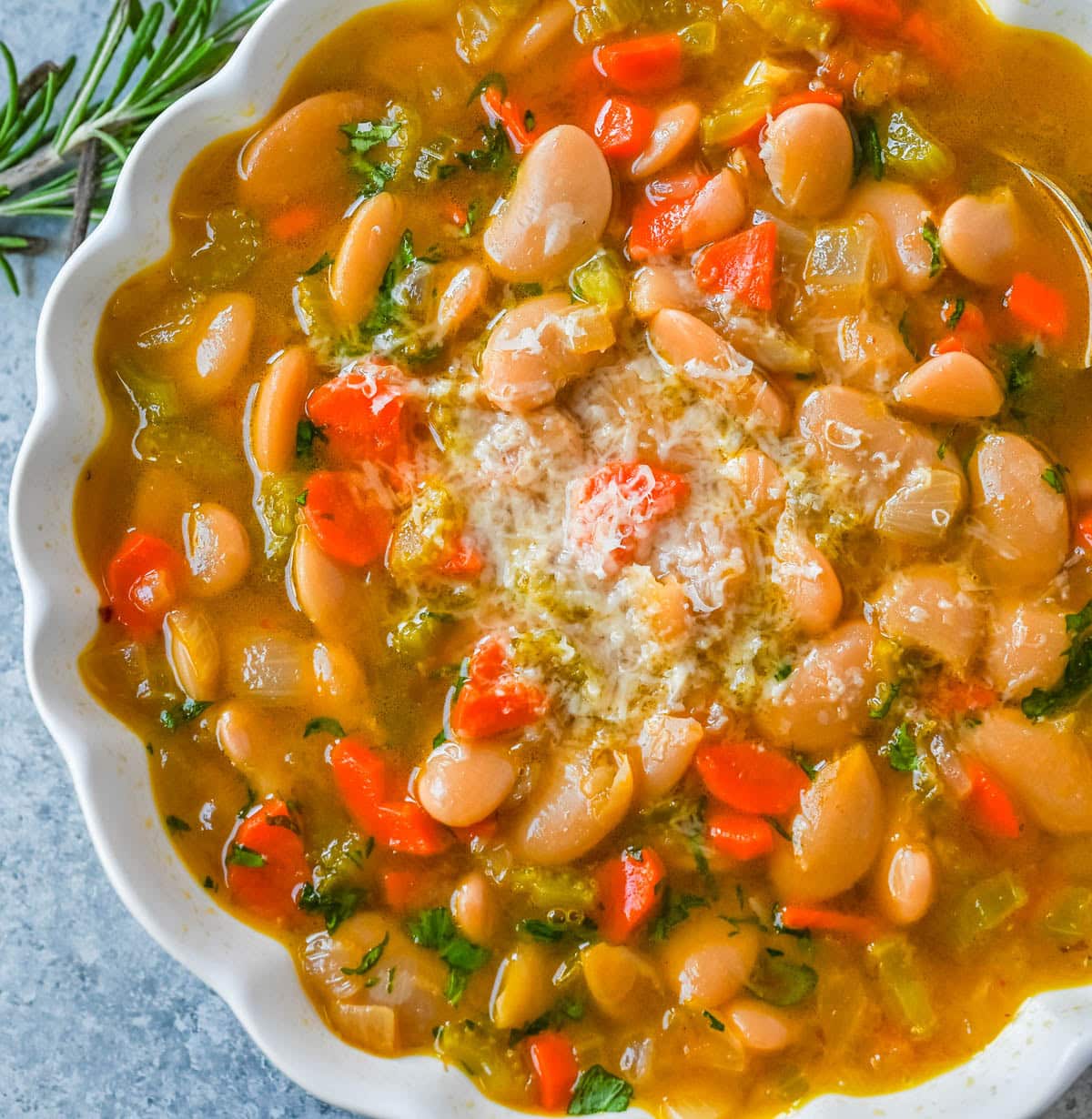 Tuscan White Bean Soup is a hearty Italian soup made with white beans, vegetables, garlic, herbs, and savory broth. It’s simple to make, incredibly comforting, and packed with protein and fiber. You will love this healthy white bean soup recipe!