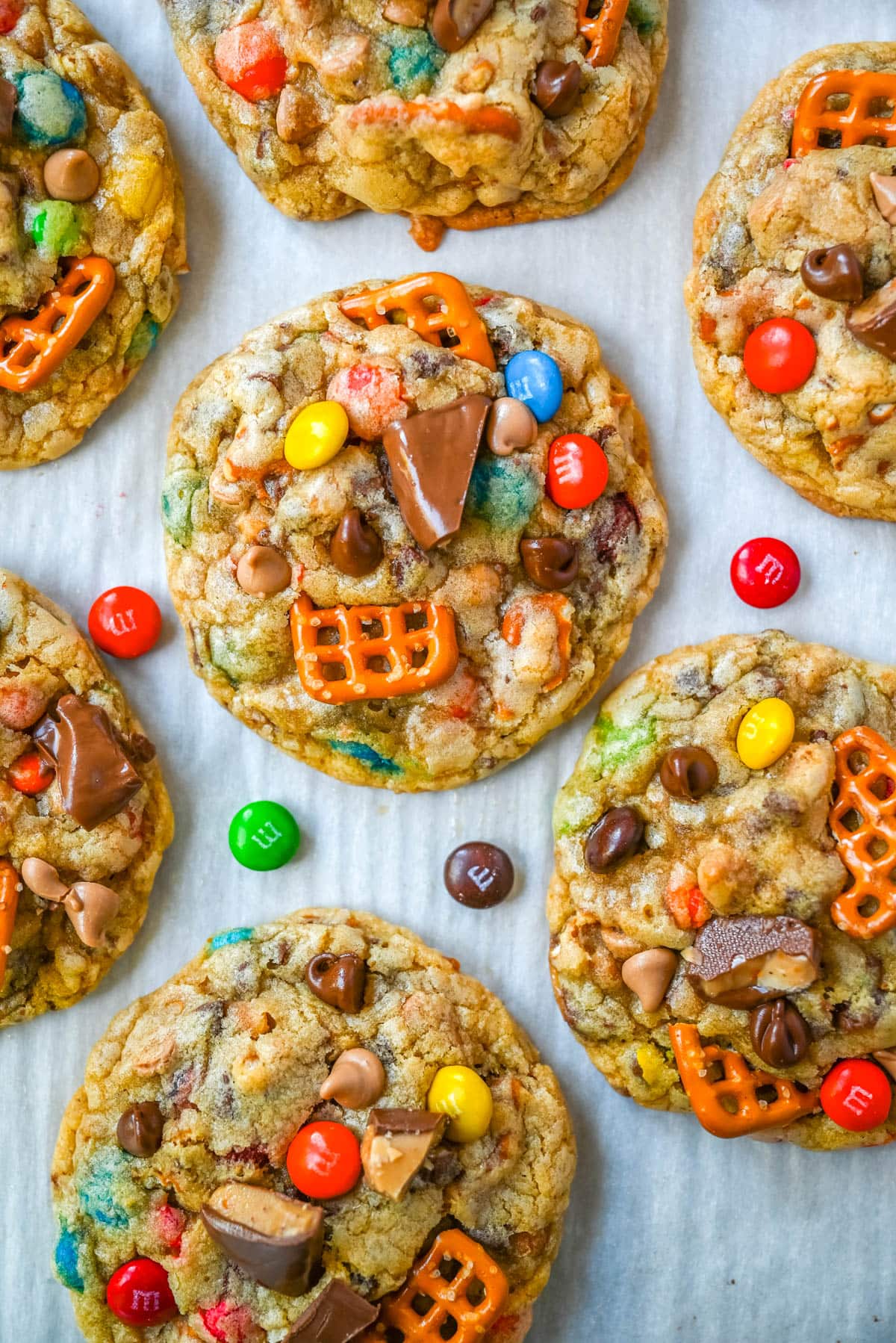 These Kitchen Sink Cookies are thick, soft, and chewy bakery-style cookies packed with chocolate chips, colorful M&M’s, crunchy pretzels, buttery toffee bits, and gooey caramel or peanut butter chips. Every bite is sweet, salty, crunchy, and chocolatey all at once. They’re called “kitchen sink” cookies because you can throw in everything but the kitchen sink, making them one of the most versatile and fully loaded cookie recipes you’ll ever bake.