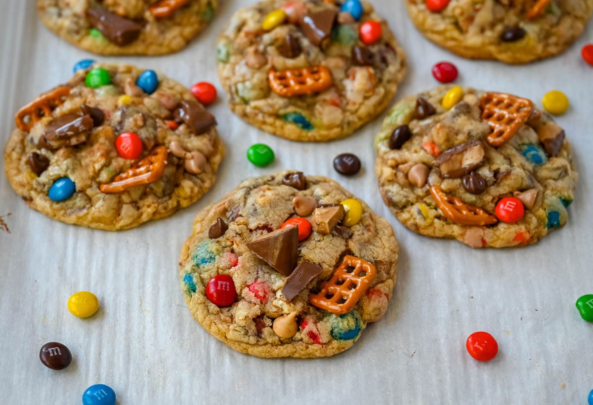 These Kitchen Sink Cookies are thick, soft, and chewy bakery-style cookies packed with chocolate chips, colorful M&M’s, crunchy pretzels, buttery toffee bits, and gooey caramel or peanut butter chips. Every bite is sweet, salty, crunchy, and chocolatey all at once. They’re called “kitchen sink” cookies because you can throw in everything but the kitchen sink, making them one of the most versatile and fully loaded cookie recipes you’ll ever bake.