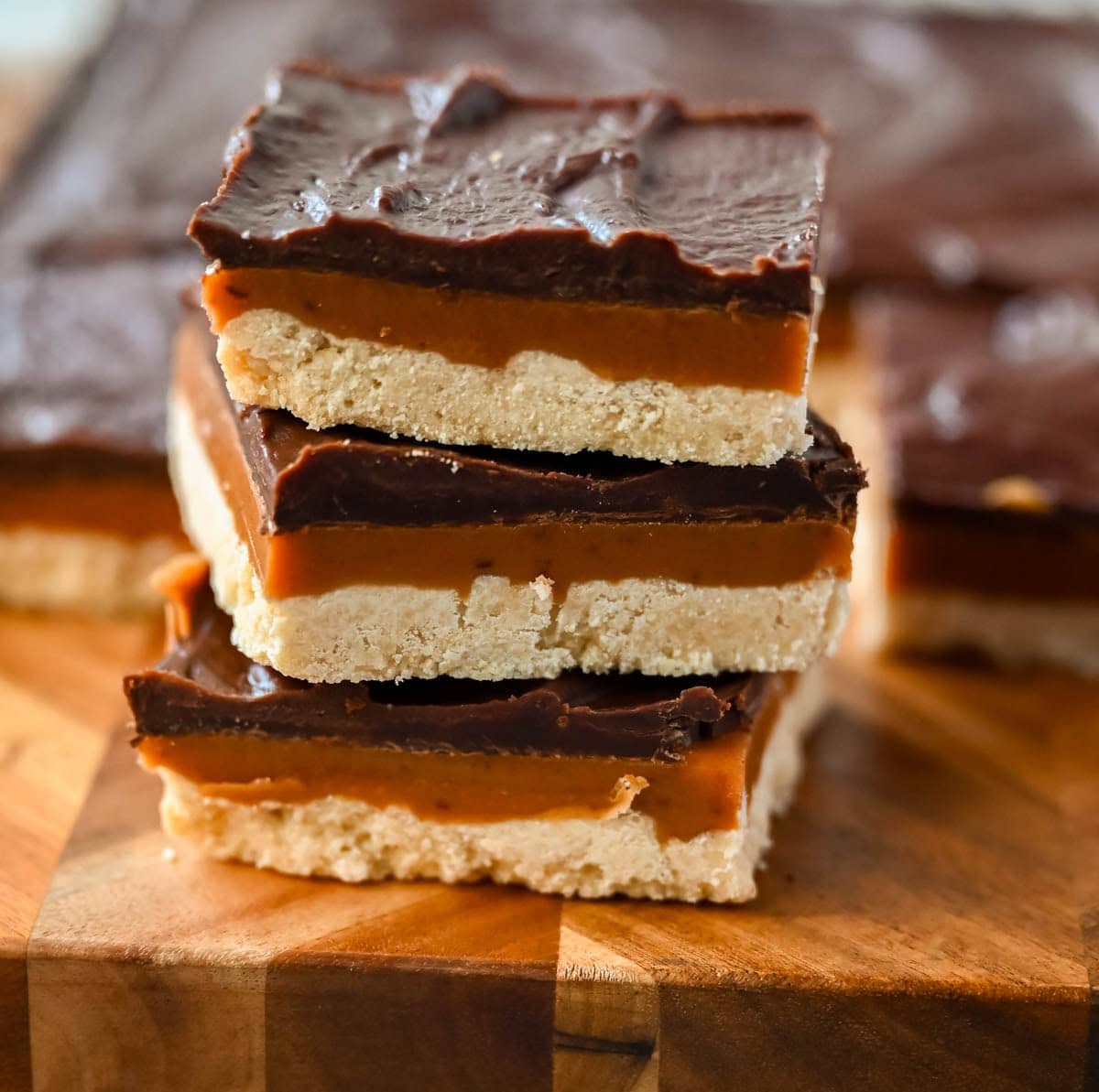 These classic, rich millionaire bars feature a buttery shortbread crust, a thick layer of smooth caramel, and a rich chocolate ganache. An easy dessert bar recipe that everyone loves!