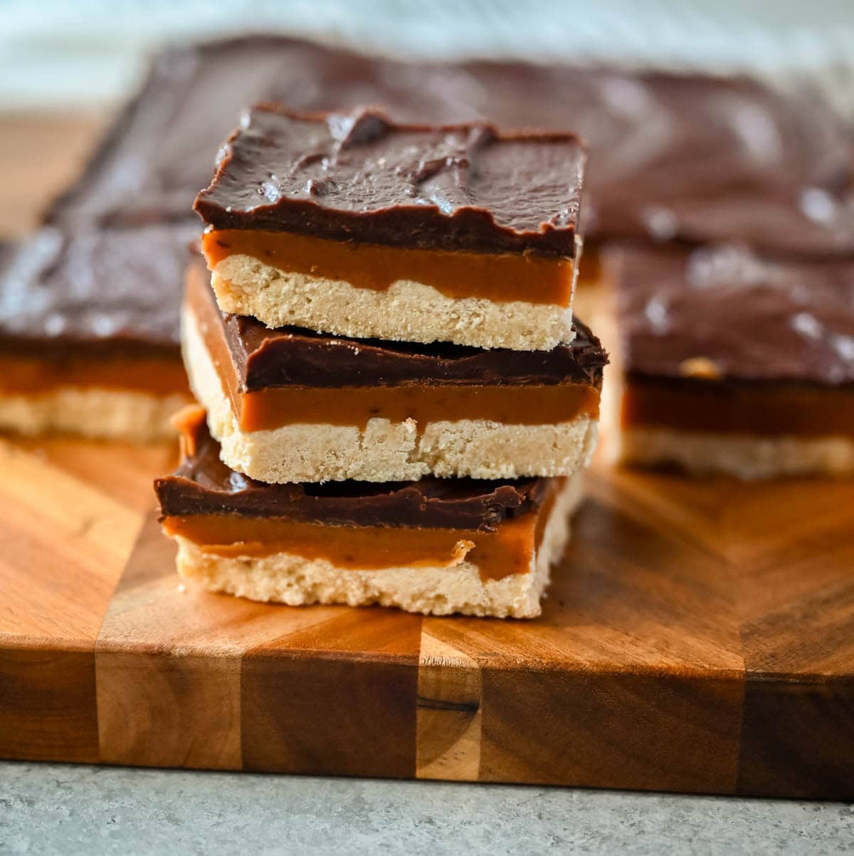 These classic, rich millionaire bars feature a buttery shortbread crust, a thick layer of smooth caramel, and a rich chocolate ganache. An easy dessert bar recipe that everyone loves!