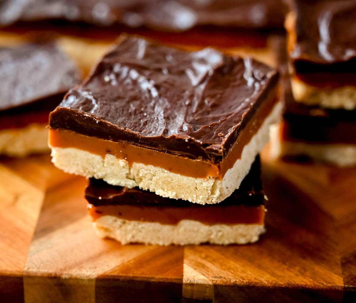 These classic, rich millionaire bars feature a buttery shortbread crust, a thick layer of smooth caramel, and a rich chocolate ganache. An easy dessert bar recipe that everyone loves!