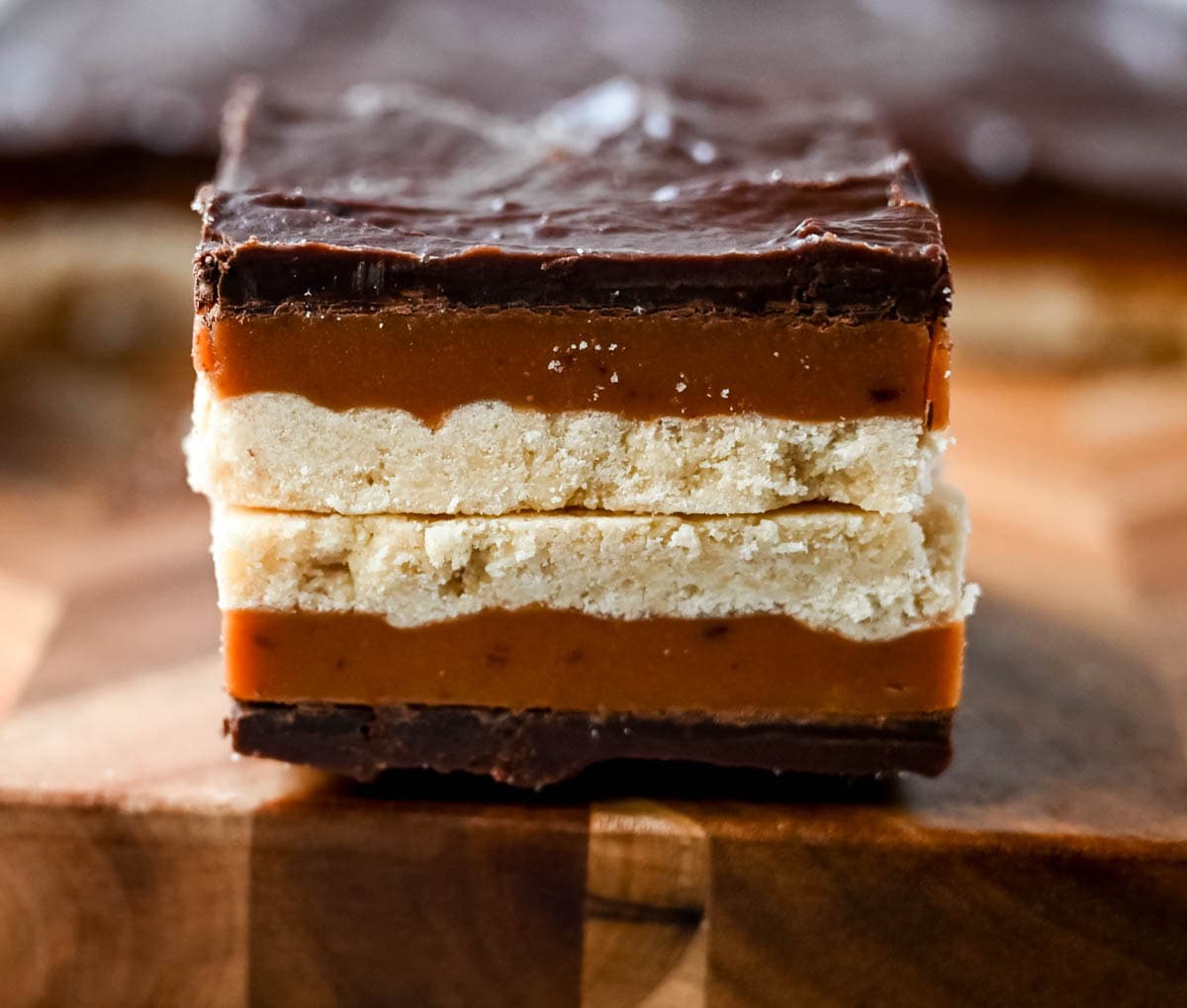 These classic, rich millionaire bars feature a buttery shortbread crust, a thick layer of smooth caramel, and a rich chocolate ganache. An easy dessert bar recipe that everyone loves!