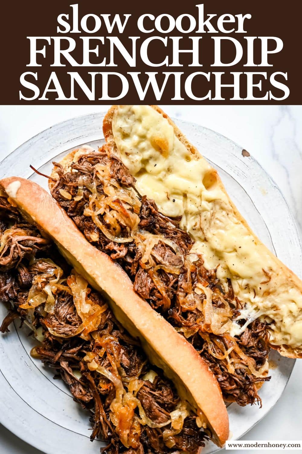 This easy slow cooker French dip sandwich recipe features tender beef, savory au jus, caramelized onions, and melted provolone cheese. Finished with a creamy horseradish aioli, it’s a restaurant-quality sandwich made right at home.
