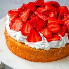 This Strawberry Shortcake Cake is a soft, buttery vanilla cake layered with fluffy homemade whipped cream and juicy strawberries. It’s the perfect spring and summer dessert that tastes like a classic strawberry shortcake but in an easy-to-slice cake form.