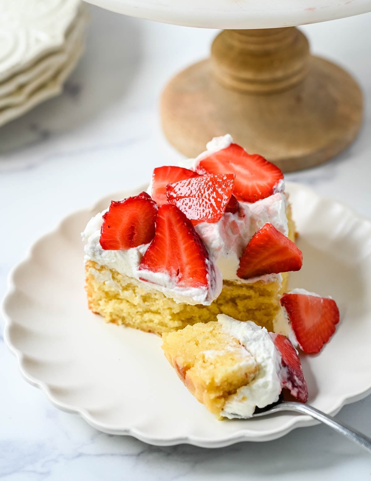 This Strawberry Shortcake Cake is a soft, buttery vanilla cake layered with fluffy homemade whipped cream and juicy strawberries. It’s the perfect spring and summer dessert that tastes like a classic strawberry shortcake but in an easy-to-slice cake form.