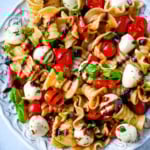 This Caprese pasta salad is a fresh, easy summer pasta salad loaded with juicy tomatoes, creamy mozzarella, and fresh basil. Tossed with olive oil and balsamic or a simple Italian dressing, it’s a light yet flavorful dish that comes together in minutes.