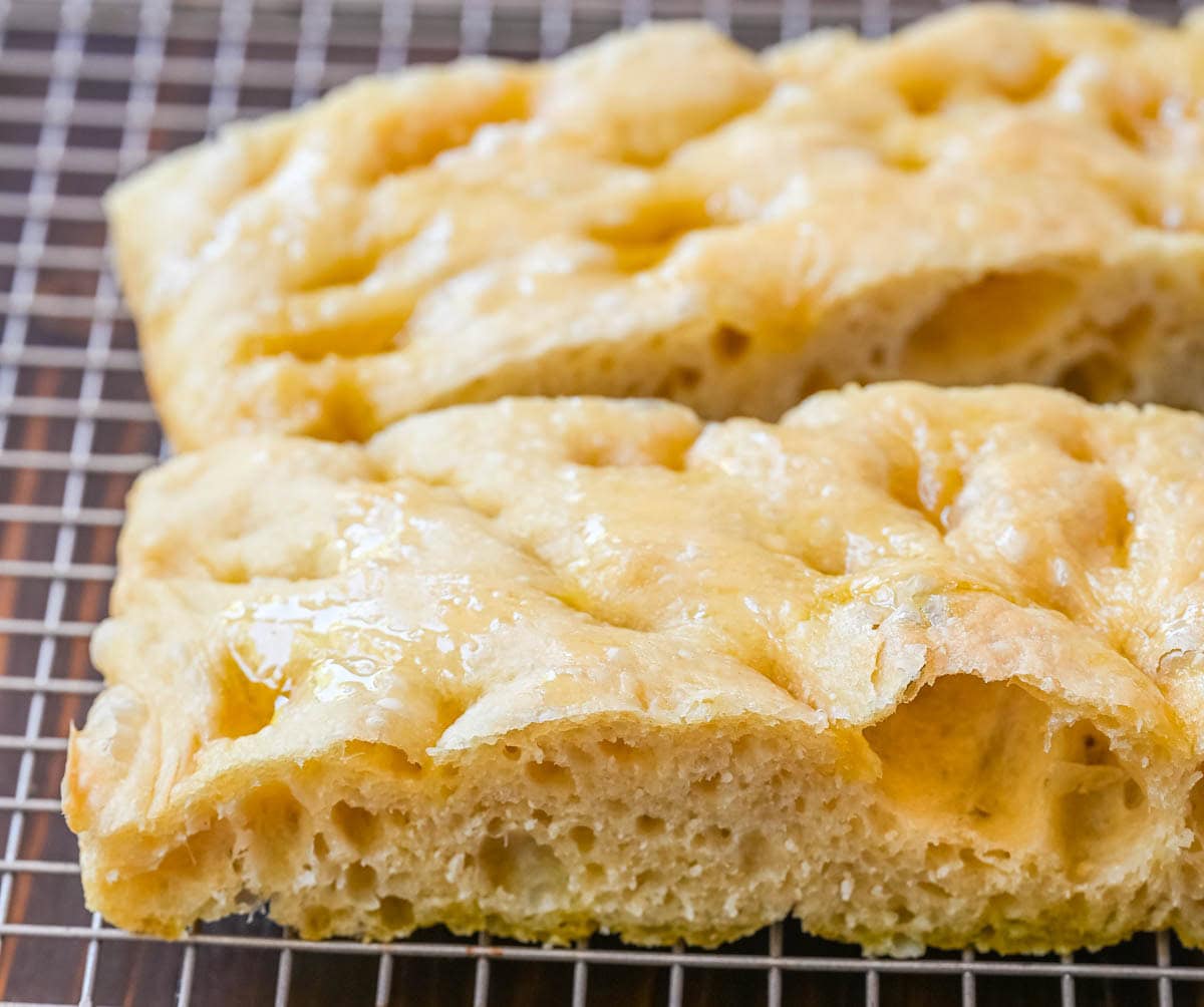 This no-knead focaccia bread is soft, fluffy on the inside, and perfectly golden and crisp on the outside with minimal effort. Made with simple pantry staples, this easy focaccia recipe uses a stretch-and-fold method instead of kneading, making it perfect for beginners. If you’re looking for an easy homemade focaccia bread recipe, this one delivers bakery-quality results every time.