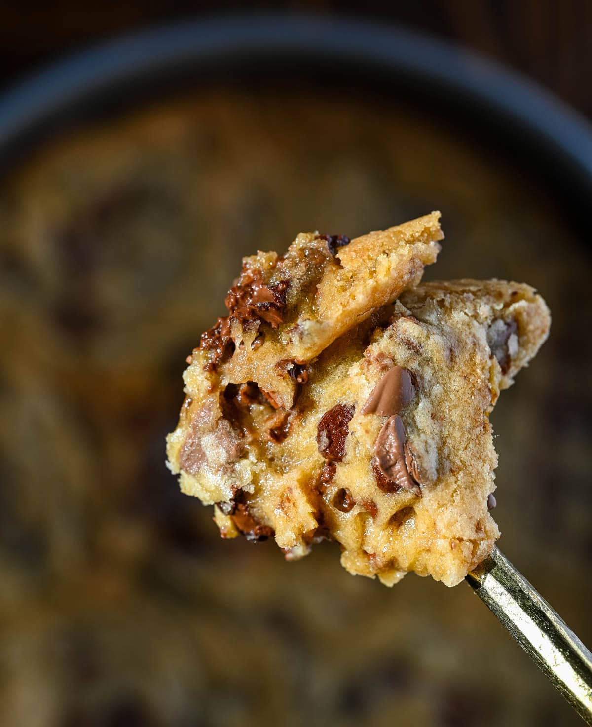 These scoopable cookies are the viral TikTok cookie trend everyone is obsessed with that's soft, gooey, and intentionally slightly underbaked so you can scoop them straight from the pan. Made with classic chocolate chip cookie dough, they bake into a warm, melty, almost brownie-like texture that’s completely irresistible. Instead of perfectly shaped cookies, you get a soft cookie “skillet-style” dessert that’s perfect for spooning and sharing!