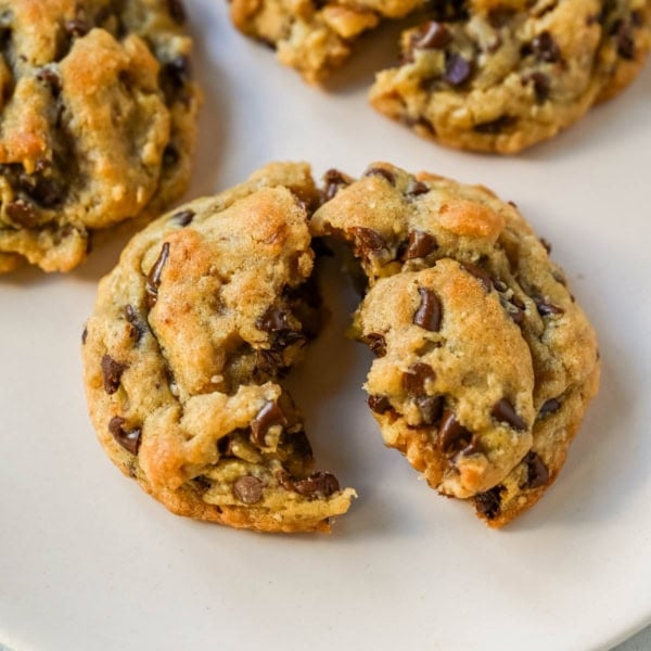 The famous DoubleTree Hotel chocolate chip cookie recipe is officially out — and it's even better homemade. These oversized, chewy, warm cookies are loaded with mini chocolate chips, ground oats for the most incredible texture, and a surprise ingredient. These Doubletree Hotel copycat chocolate chip cookies are the perfect chocolate chip cookie recipe.