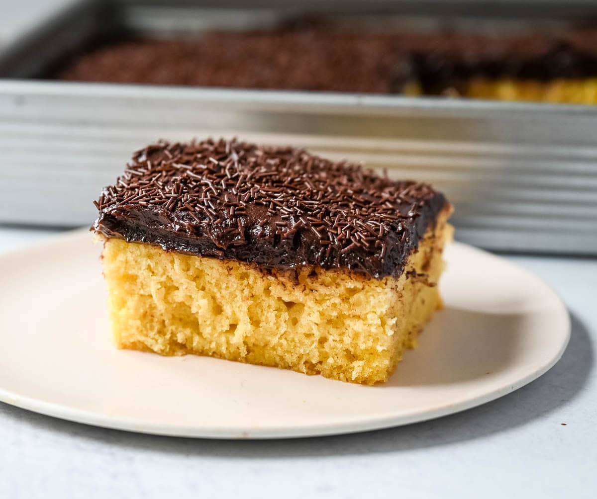This yellow sheet cake with chocolate frosting is soft, buttery, and perfectly moist with a rich, classic flavor. The fluffy yellow sheet cake pairs beautifully with a smooth, creamy chocolate frosting that melts in every bite. The best yellow cake with chocolate frosting!