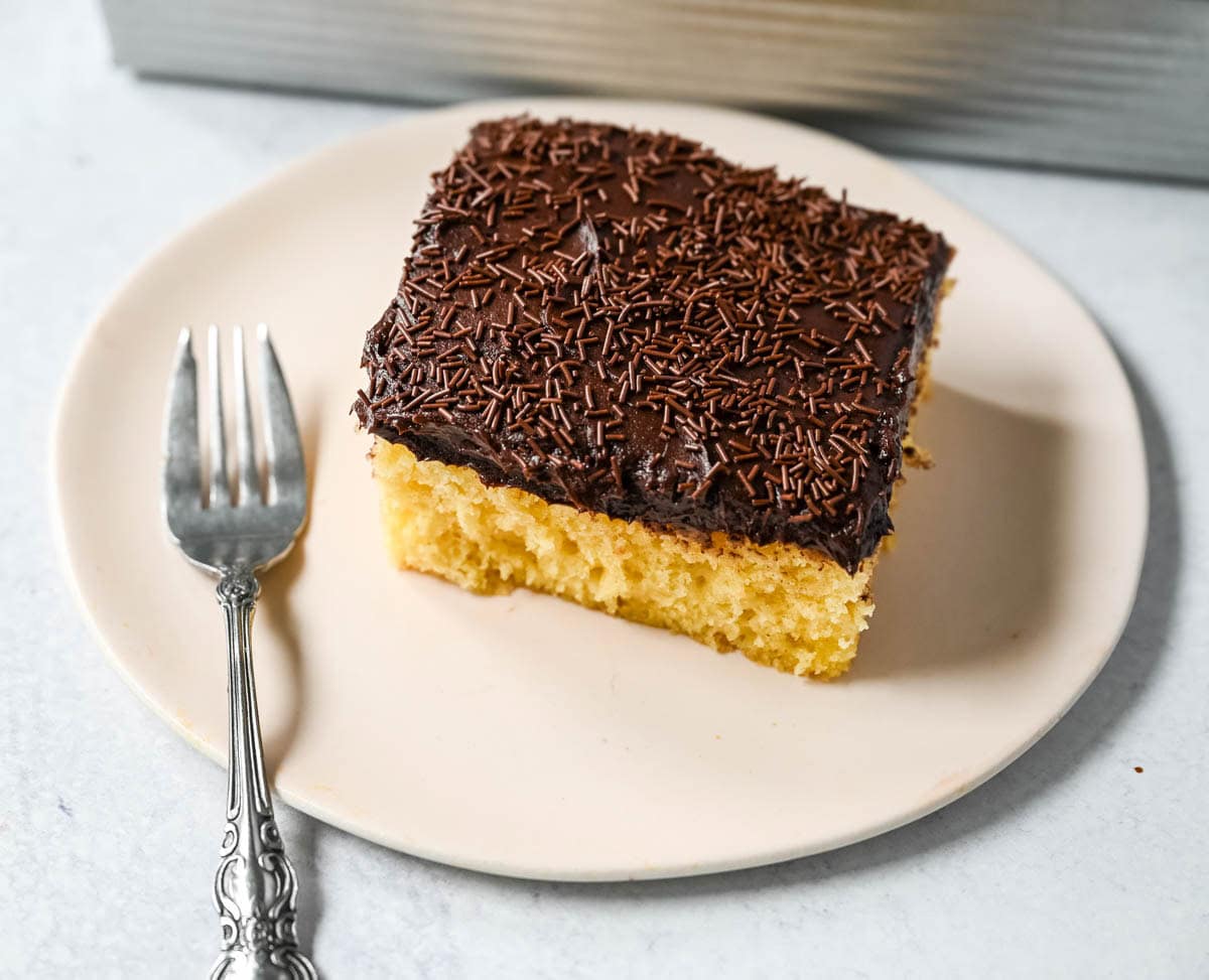 This yellow sheet cake with chocolate frosting is soft, buttery, and perfectly moist with a rich, classic flavor. The fluffy yellow sheet cake pairs beautifully with a smooth, creamy chocolate frosting that melts in every bite. The best yellow cake with chocolate frosting!