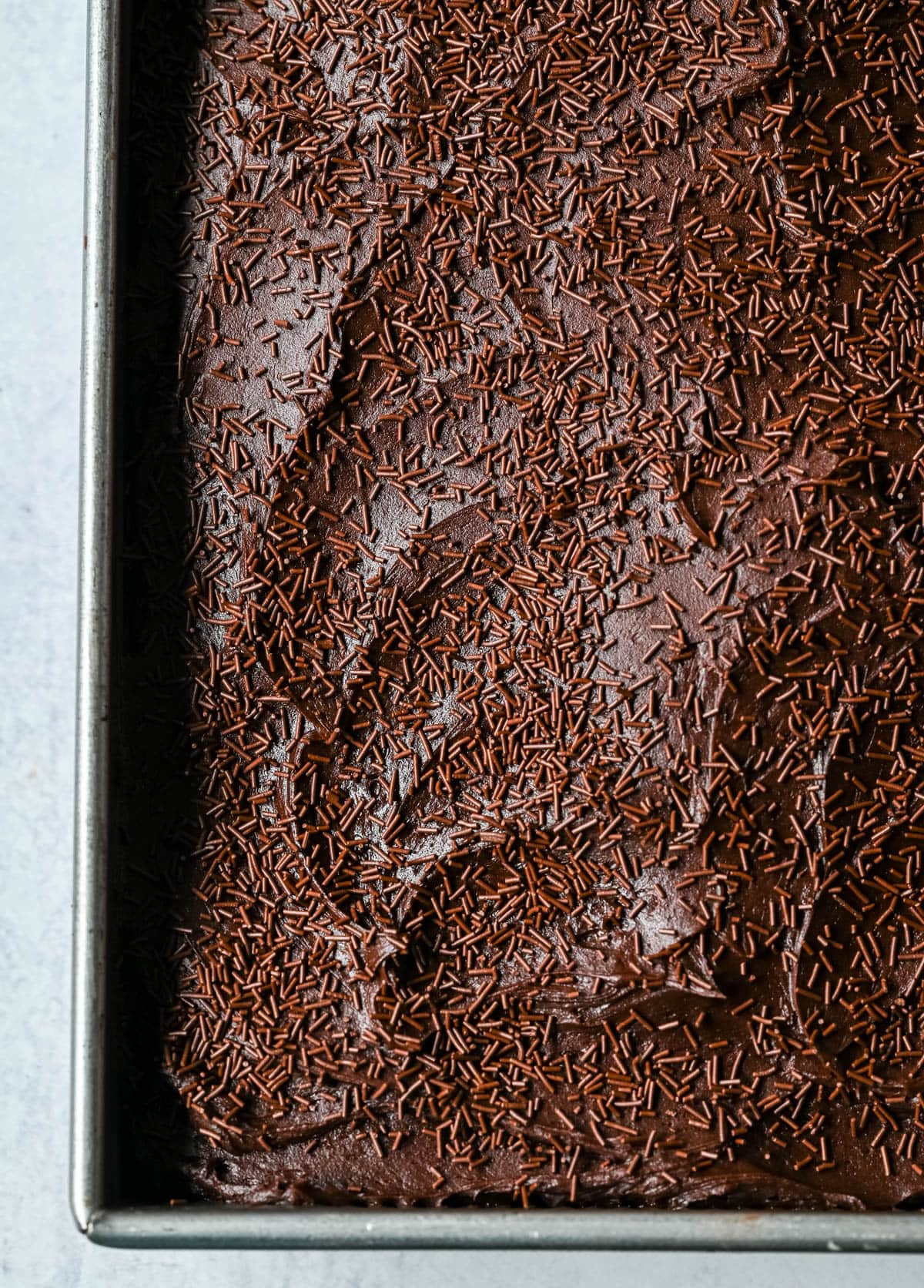 This yellow sheet cake with chocolate frosting is soft, buttery, and perfectly moist with a rich, classic flavor. The fluffy yellow sheet cake pairs beautifully with a smooth, creamy chocolate frosting that melts in every bite. The best yellow cake with chocolate frosting!