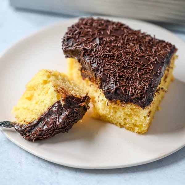 This yellow sheet cake with chocolate frosting is soft, buttery, and perfectly moist with a rich, classic flavor. The fluffy yellow sheet cake pairs beautifully with a smooth, creamy chocolate frosting that melts in every bite. The best yellow cake with chocolate frosting!