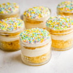 Dot Cake Recipe (Cake in a jar). This viral dot cake recipe brings the NYC sprinkle cake trend straight to your kitchen — no trip to Butterfield Market required! Soft, buttery homemade yellow cake layered in a cup, topped with creamy vanilla buttercream, and completely coated in rainbow nonpareil sprinkles for that irresistible crunch. This easy homemade version is better than any boxed mix recipe you'll find — and takes less than an hour to make!