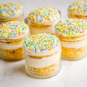 Dot Cake Recipe (Cake in a jar). This viral dot cake recipe brings the NYC sprinkle cake trend straight to your kitchen — no trip to Butterfield Market required! Soft, buttery homemade yellow cake layered in a cup, topped with creamy vanilla buttercream, and completely coated in rainbow nonpareil sprinkles for that irresistible crunch. This easy homemade version is better than any boxed mix recipe you'll find — and takes less than an hour to make!