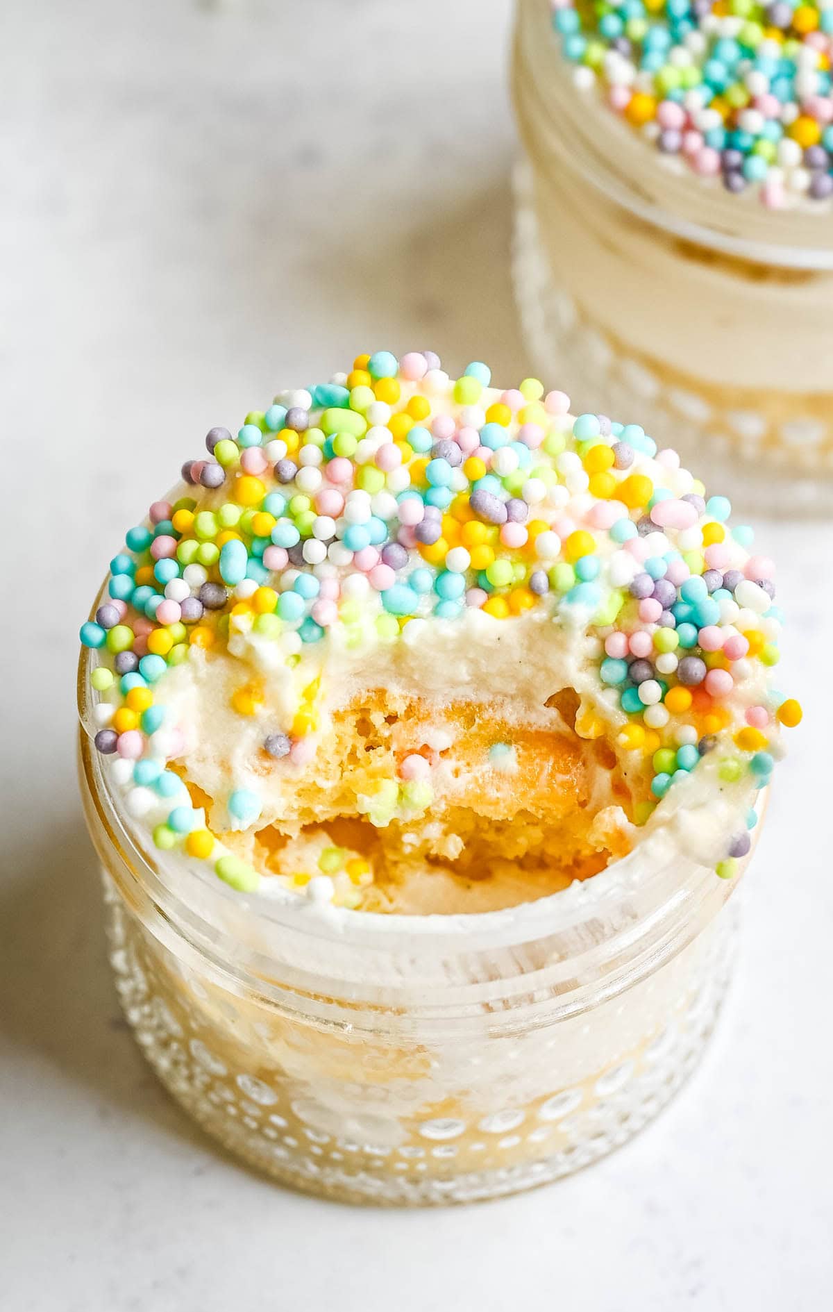 Dot Cake Recipe (Cake in a jar). This viral dot cake recipe brings the NYC sprinkle cake trend straight to your kitchen — no trip to Butterfield Market required! Soft, buttery homemade yellow cake layered in a cup, topped with creamy vanilla buttercream, and completely coated in rainbow nonpareil sprinkles for that irresistible crunch. This easy homemade version is better than any boxed mix recipe you'll find — and takes less than an hour to make!