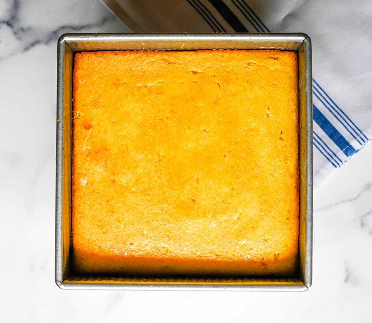 This moist and fluffy hot honey cornbread is sweet, slightly spicy, and absolutely packed with flavor from the very first bite! This is the most irresistible cornbread topped with hot honey butter you will ever make, and it comes together in just one bowl in under 30 minutes, making it the easiest and most flavorful side dish.