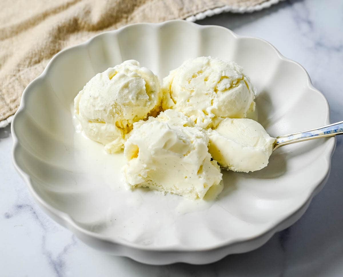 Sweet, creamy, and smooth, this copycat Jeni's Sweet Cream Ice Cream is the homemade ice cream recipe every ice cream lover needs in their life! The secret to Jeni's famously creamy and scoopable texture is a combination of cream cheese, cornstarch, and light corn syrup that prevents ice crystals from forming and keeps every single scoop silky smooth straight from the freezer. This is the ultimate homemade ice cream recipe you will make on repeat all summer long!