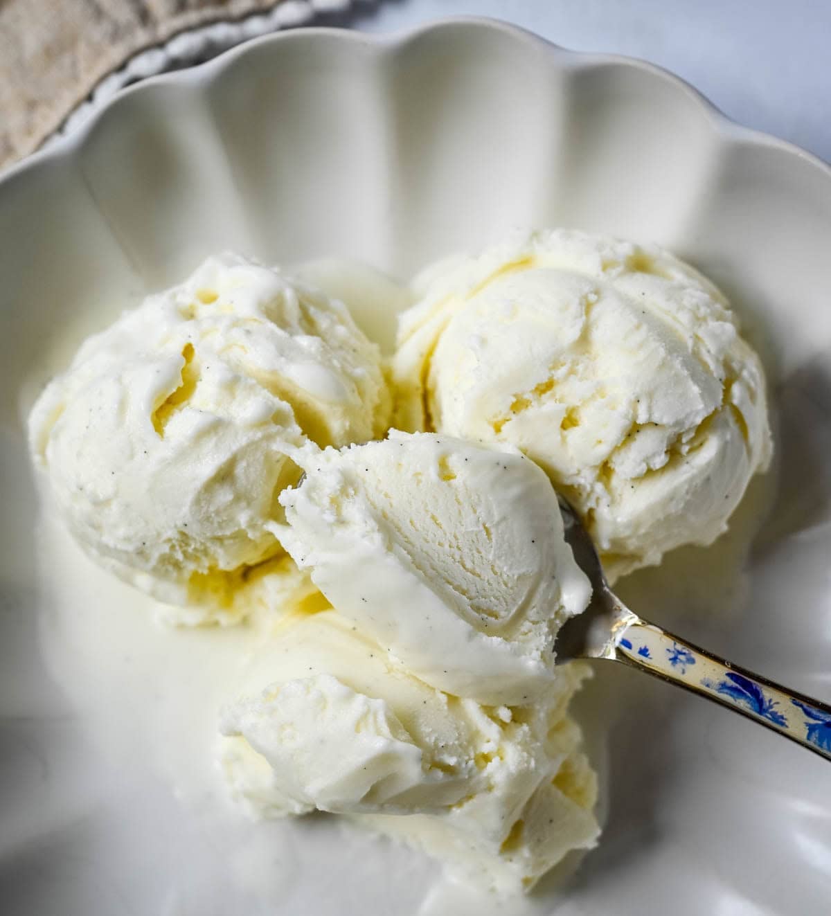 Sweet, creamy, and smooth, this copycat Jeni's Sweet Cream Ice Cream is the homemade ice cream recipe every ice cream lover needs in their life! The secret to Jeni's famously creamy and scoopable texture is a combination of cream cheese, cornstarch, and light corn syrup that prevents ice crystals from forming and keeps every single scoop silky smooth straight from the freezer. This is the ultimate homemade ice cream recipe you will make on repeat all summer long!