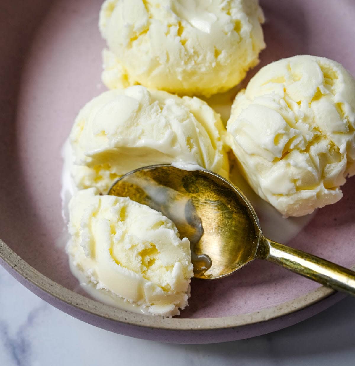 Sweet, creamy, and smooth, this copycat Jeni's Sweet Cream Ice Cream is the homemade ice cream recipe every ice cream lover needs in their life! The secret to Jeni's famously creamy and scoopable texture is a combination of cream cheese, cornstarch, and light corn syrup that prevents ice crystals from forming and keeps every single scoop silky smooth straight from the freezer. This is the ultimate homemade ice cream recipe you will make on repeat all summer long!