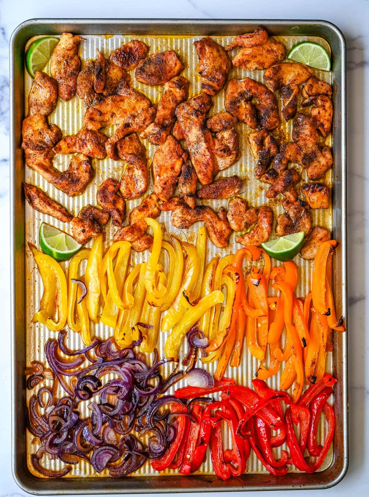 These sheet pan chicken fajitas are the easiest weeknight dinner you will ever make, with juicy seasoned chicken, colorful bell peppers, and sweet onion all roasted together on one pan for minimal cleanup. These easy chicken fajitas are a healthy, flavorful weeknight dinner served with all your favorite toppings.