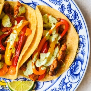 These sheet pan chicken fajitas are the easiest weeknight dinner you will ever make, with juicy seasoned chicken, colorful bell peppers, and sweet onion all roasted together on one pan for minimal cleanup. These easy chicken fajitas are a healthy, flavorful weeknight dinner served with all your favorite toppings.
