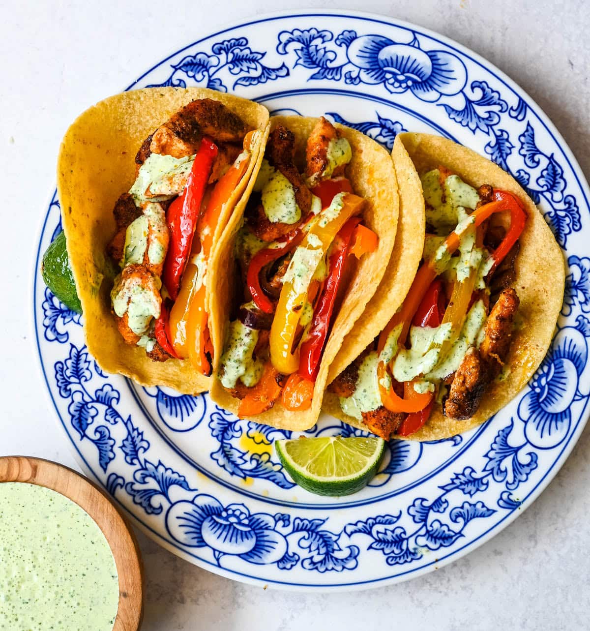 These sheet pan chicken fajitas are the easiest weeknight dinner you will ever make, with juicy seasoned chicken, colorful bell peppers, and sweet onion all roasted together on one pan for minimal cleanup. These easy chicken fajitas are a healthy, flavorful weeknight dinner served with all your favorite toppings.
