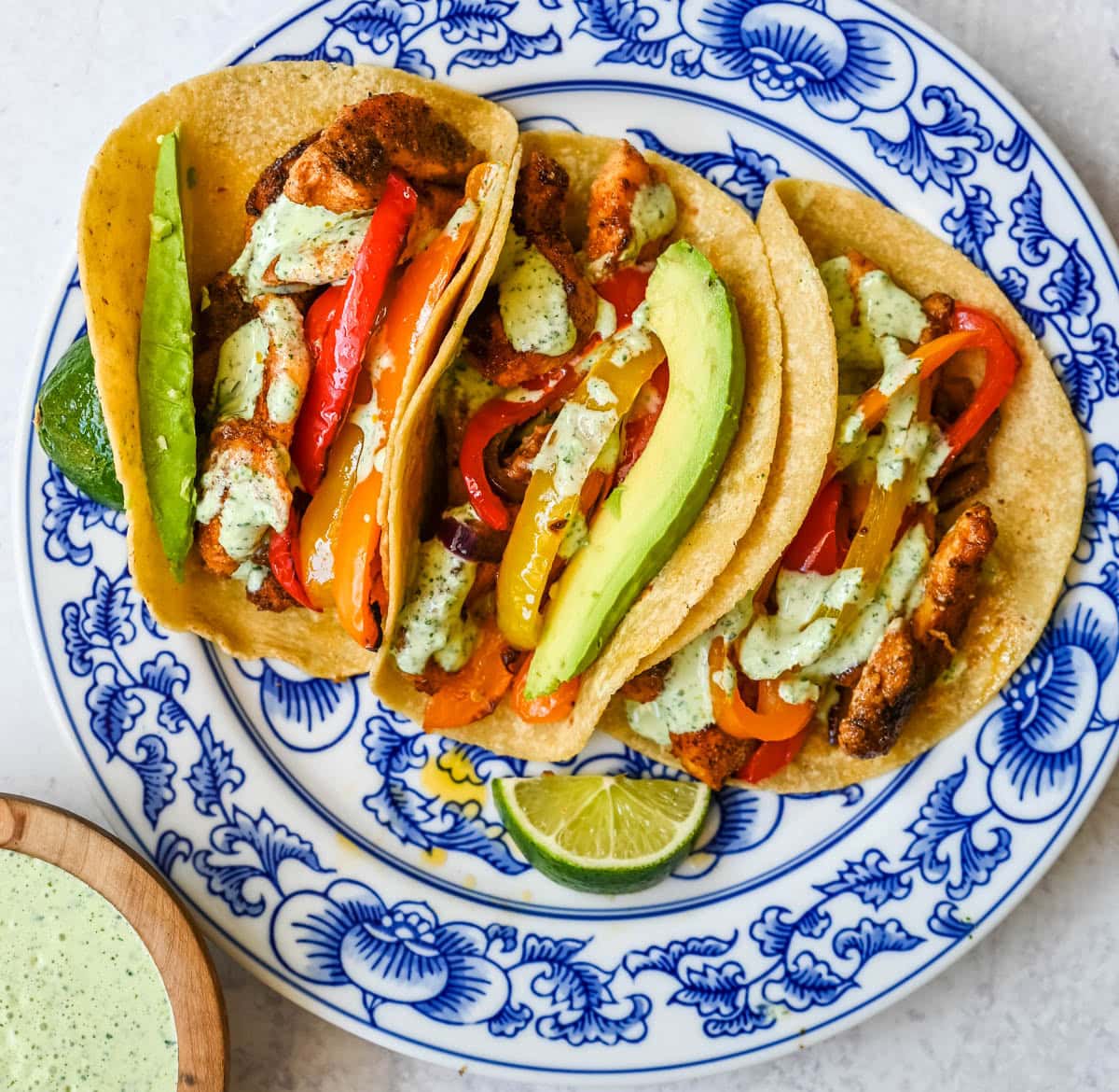 These sheet pan chicken fajitas are the easiest weeknight dinner you will ever make, with juicy seasoned chicken, colorful bell peppers, and sweet onion all roasted together on one pan for minimal cleanup. These easy chicken fajitas are a healthy, flavorful weeknight dinner served with all your favorite toppings.