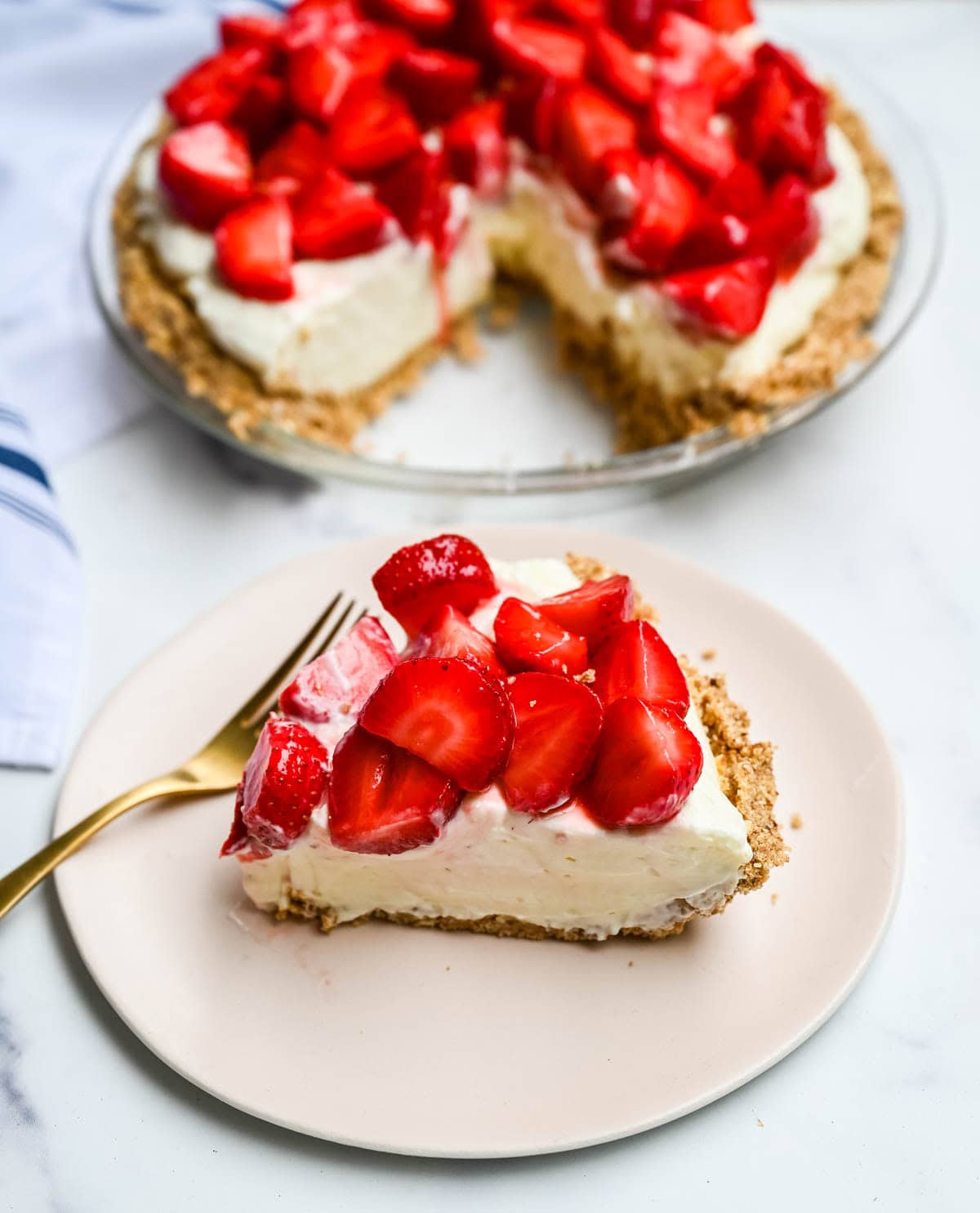 This strawberry pretzel pie has no Jello — just a buttery pretzel crust, fluffy no-bake cream cheese filling, and fresh sweet strawberries for the ultimate no-bake summer dessert that's as easy as it is show-stopping.