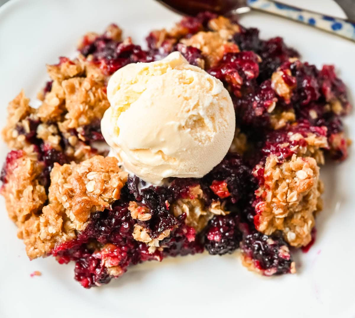 Easy Blackberry Crisp made with juicy blackberries and a buttery brown sugar oat topping. Ready in under an hour — the perfect summer dessert, made with fresh or frozen berries.