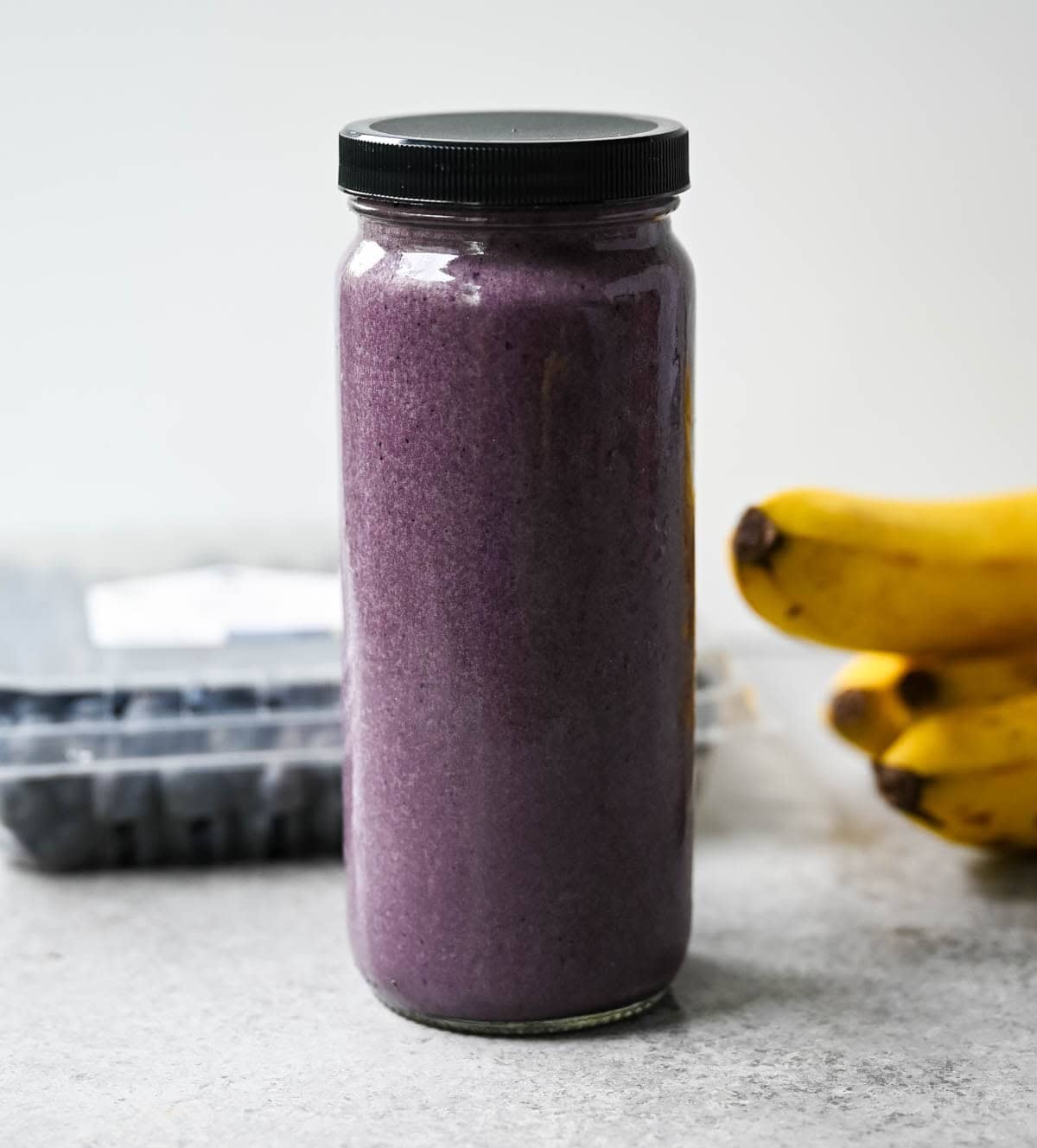 Tastes like a chocolate milkshake but built with protein, greens, and healthy fats — a smoothie that feels like a treat. Chocolate protein smoothie with spinach and blueberries