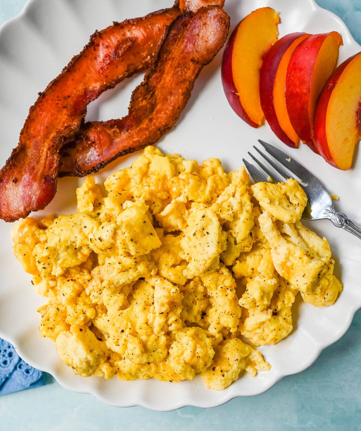 These Cottage Cheese Scrambled Eggs are the creamiest, fluffiest scrambled eggs you'll ever make — with over 20g of protein per serving! Learn the simple technique, the best mix-ins, and every tip for perfect scrambled eggs every time.