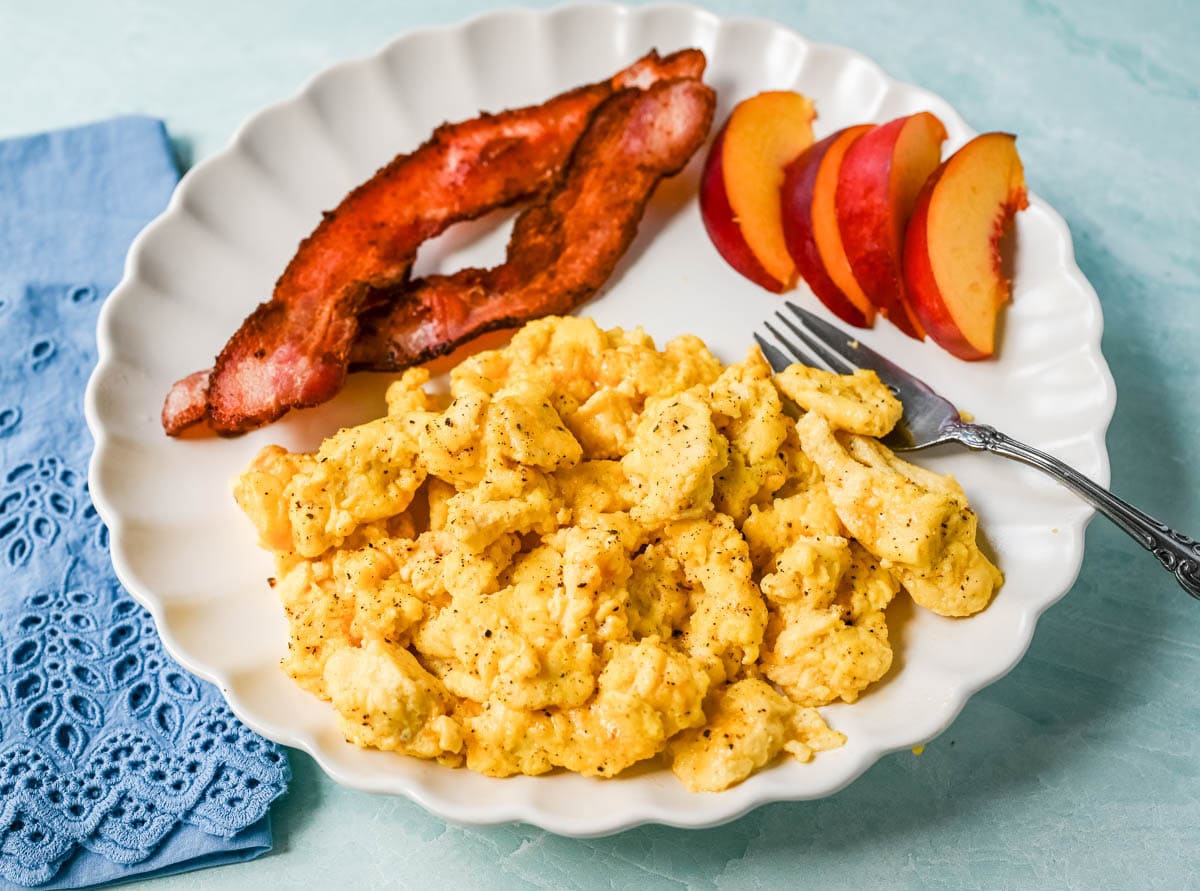 These Cottage Cheese Scrambled Eggs are the creamiest, fluffiest scrambled eggs you'll ever make — with over 20g of protein per serving! Learn the simple technique, the best mix-ins, and every tip for perfect scrambled eggs every time.