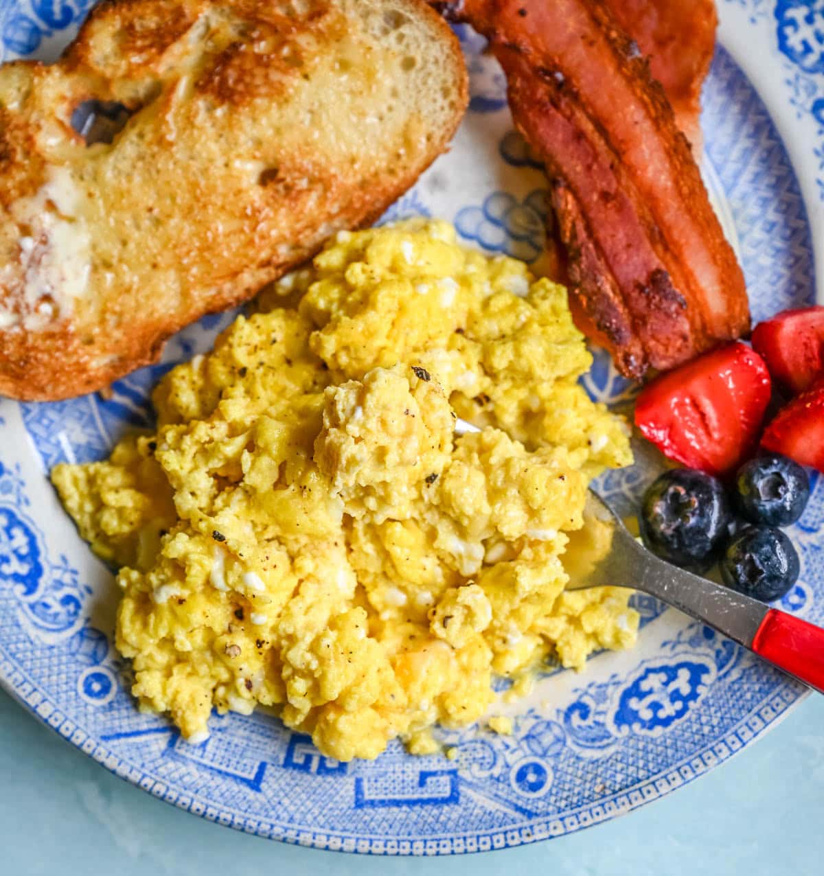 These Cottage Cheese Scrambled Eggs are the creamiest, fluffiest scrambled eggs you'll ever make — with over 20g of protein per serving! Learn the simple technique, the best mix-ins, and every tip for perfect scrambled eggs every time.